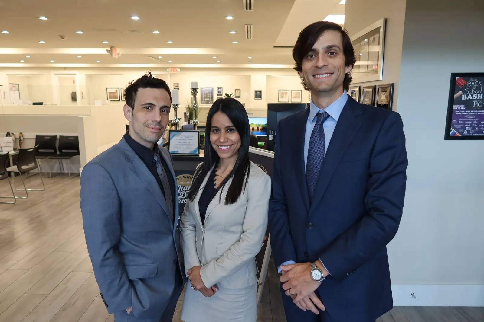 Attorneys Stephen Cordero, Miriam Marenco and Sean Cordero in the lobby of the firm’s Miami office